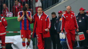 Bayern striker Robert Lewandowski goes off the field after sustaining a head injury in the german cup defeat by Dortmund