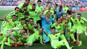 The Barcelona players celebrate clinching the Spanish league title